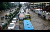 Commuters stuck in floodwaters in Bangladesh's Dhaka | AFP